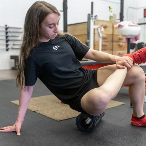 Sandra foam rolling in the TEM competition shirt